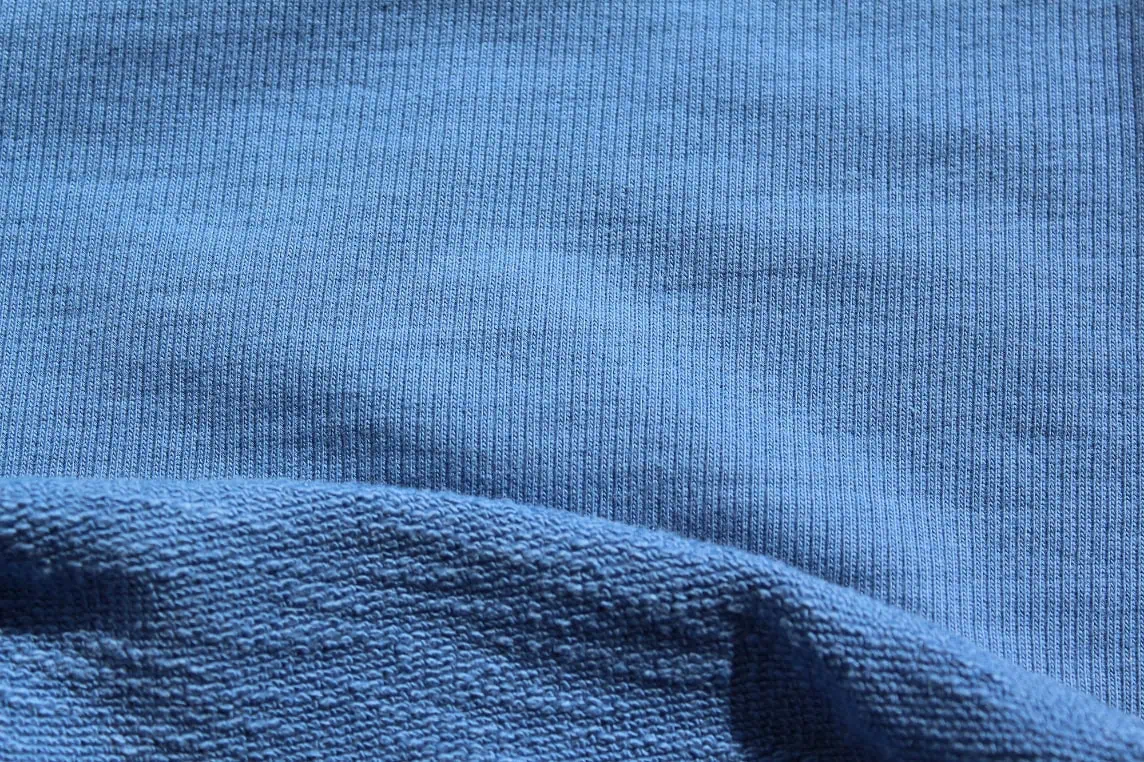 Close-up of a heavyweight Terry sweatshirt with a subtly ridged texture, adding surface interest