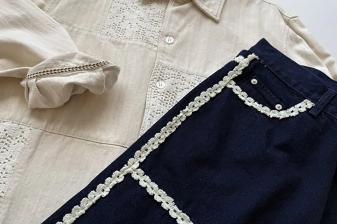 Close-up of classic denim silhouettes with artisanal accents, giving them a homespun feel.