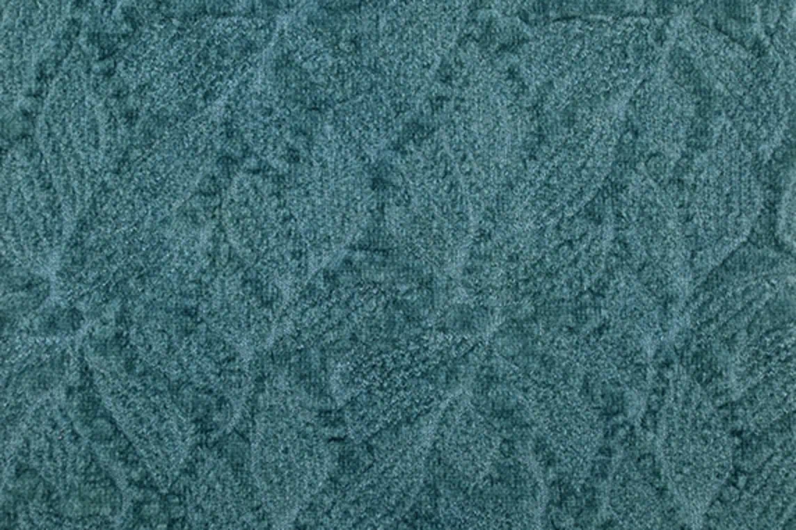 Close-up of cotton blend knit fabric featuring a floral motif with chenille yarns, dyed with natural indigo and pomegranate dye.