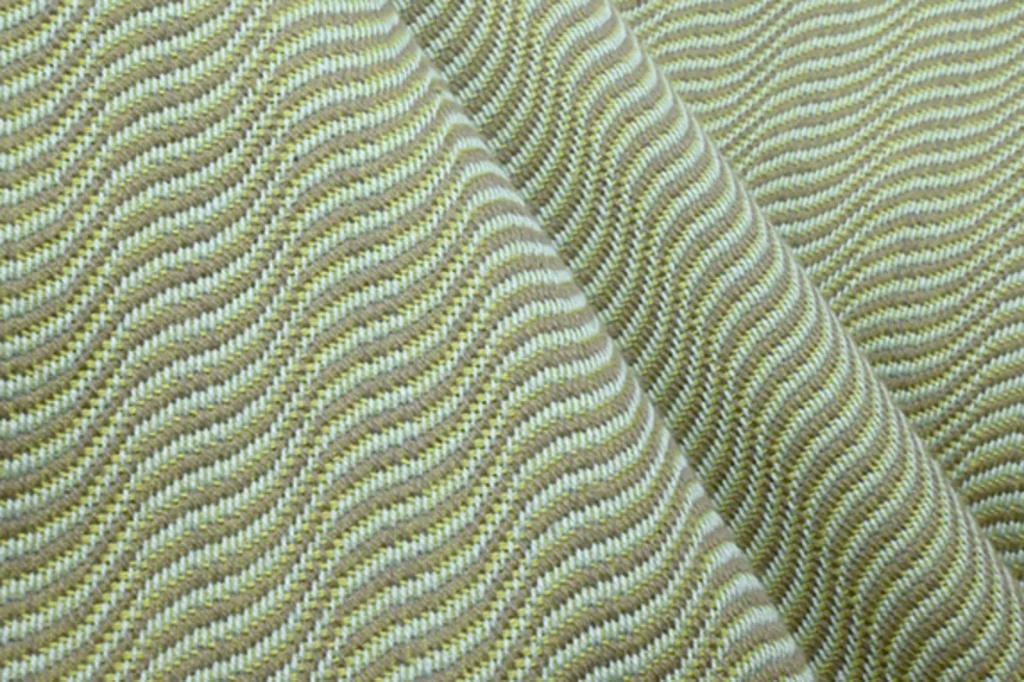 Close-up of 100% cotton dobby fabric with undulating twill, creating a unique shadow effect.